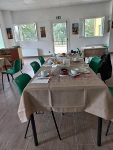a table in a room with a table cloth on it at Gardafarm agriturismo in Verona
