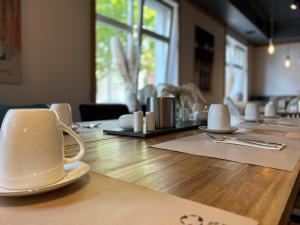 a table with a coffee cup on top of it at Hotel zur Amtspforte in Stadthagen