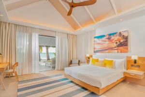 Postel nebo postele na pokoji v ubytování Nova Maldives