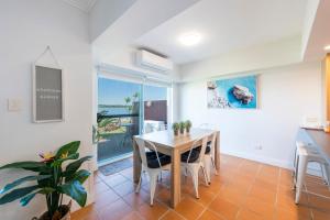 a kitchen and dining room with a table and chairs at Riverview Apartments 2 3 Building 2 Unit 3 in Iluka