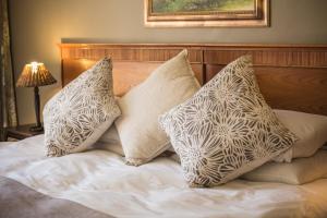 Postel nebo postele na pokoji v ubytování Acacia Guesthouse Klerksdorp