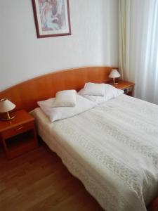Postel nebo postele na pokoji v ubytování Geovita Dąbki