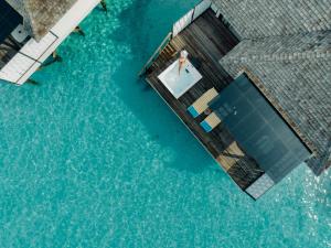 Bazén v ubytování Nova Maldives nebo v jeho okolí