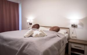 Posteľ alebo postele v izbe v ubytovaní Tri Duby Golf Apartments