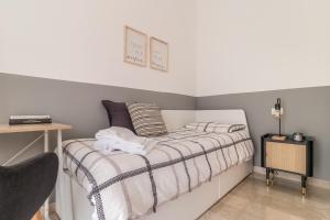 Posteľ alebo postele v izbe v ubytovaní Grey House in the heart of @Treviso