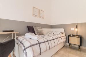 Posteľ alebo postele v izbe v ubytovaní Grey House in the heart of @Treviso