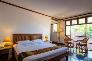 Postel nebo postele na pokoji v ubytování Baan Hin Sai Resort & Spa