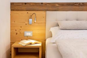Posteľ alebo postele v izbe v ubytovaní Ciasa Rungg Monte Sella Suite