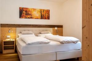 Posteľ alebo postele v izbe v ubytovaní Ciasa Rungg Monte Sella Suite
