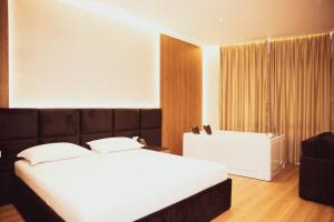Postel nebo postele na pokoji v ubytování Hotel Continental