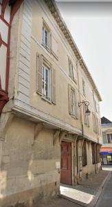 an old building on the side of a street at Trés jolie Studio Hyper Centre in Troyes