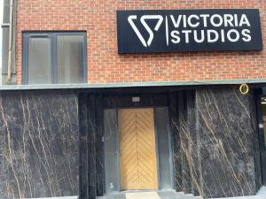 a building with a door and a sign on it at Victoria Studios in London