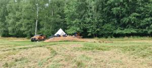a pile of dirt in a field with a tent at Apartmány Tollendorf Lužické hory in Jiřetín pod Jedlovou