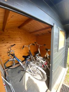 two bikes are parked in a garage at Het Pelgrimshoekje in Vrouwenpolder