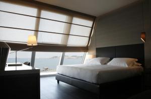 Voodi või voodid majutusasutuse Ego Hotel toas