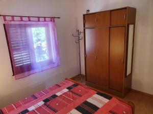 Postel nebo postele na pokoji v ubytování Apartmani Ruk