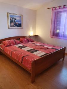Postel nebo postele na pokoji v ubytování Apartmani Ruk