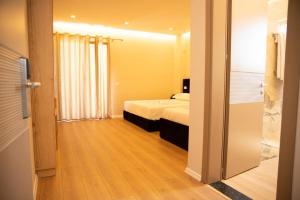 Postel nebo postele na pokoji v ubytování Hotel Continental