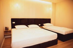Postel nebo postele na pokoji v ubytování Hotel Continental