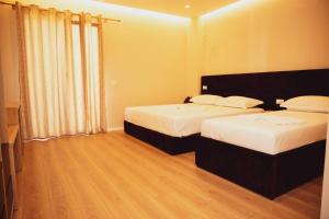 Postel nebo postele na pokoji v ubytování Hotel Continental
