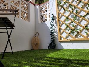 a room with a window and a green lawn at "COZY LOFT", TERRACE, PARKING and SWIMMING POOL in Málaga