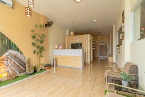 an empty room with a kitchen and a dining room at RedDoorz Plus Near RS Royal Taruma Grogol in Jakarta