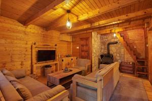a living room in a log cabin at Country House Brijest in Kolašin