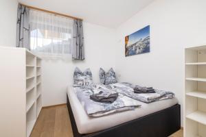 Postel nebo postele na pokoji v ubytování Fischis Alpen Appartements