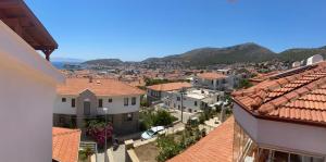 a view of a town with buildings and the ocean at Triplex house, near center and sea in Datca