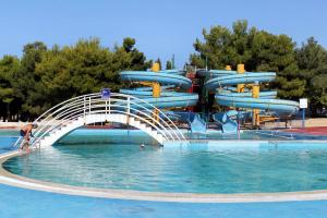 a water park with a water slide in the water at Apartments by the sea Rovinj - 17935 in Rovinj