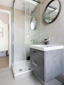 a bathroom with a sink and a shower at limehome Berlin Luise Henriette Str - Digital Access in Berlin
