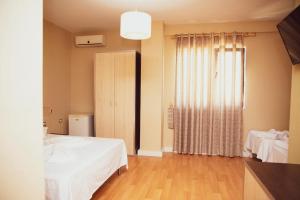Postel nebo postele na pokoji v ubytování Hotel Continental