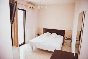Postel nebo postele na pokoji v ubytování Hotel Continental