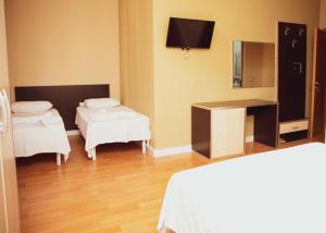 Postel nebo postele na pokoji v ubytování Hotel Continental
