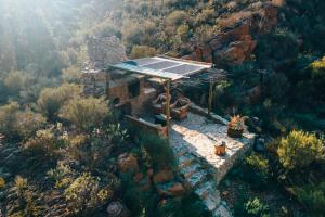 an aerial view of a house with a solar roof at Wolwehoek Private Reserve in Montagu