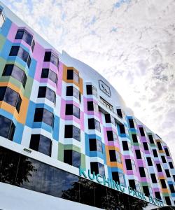 a building with a colorful facade with the sky in the background at Kuching Park Hotel in Kuching