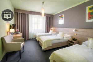 Postel nebo postele na pokoji v ubytování Atlantic Hotel