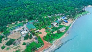 an aerial view of a house on an island in the water at Lotus Eco Resort Konark in Konārka