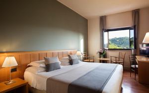 Postel nebo postele na pokoji v ubytování Hotel dei Duchi