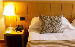 Postel nebo postele na pokoji v ubytování Hotel dei Duchi
