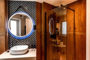 a bathroom with a sink and a mirror at Stables Ashbourne in Ashbourne