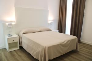 Postel nebo postele na pokoji v ubytování Hotel Esplanade