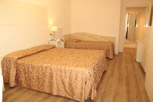 Postel nebo postele na pokoji v ubytování Hotel Esplanade