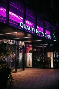 a store front of a building with purple lights at Quality Hotel Globe in Stockholm