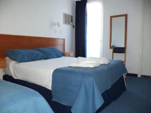 Voodi või voodid majutusasutuse Hotel Escorial toas
