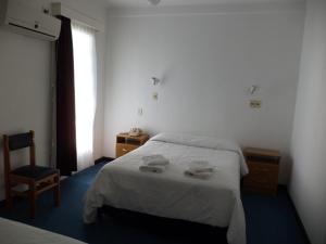 Voodi või voodid majutusasutuse Hotel Escorial toas