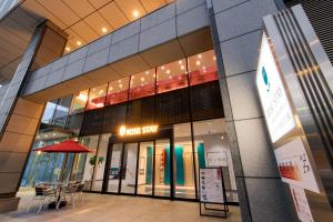 a store front of a building with alost sky sign at Rose Stay Tokyo Shiba Park in Tokyo
