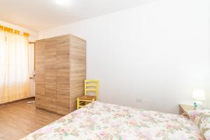 A bed or beds in a room at Sea Shell Isola Rossa