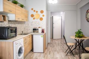 Kuchyň nebo kuchyňský kout v ubytování Ermou 18 Mosaics boutique apartment