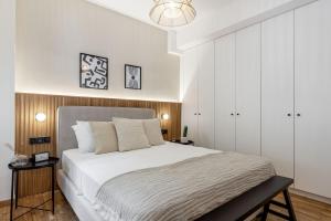 Posteľ alebo postele v izbe v ubytovaní Dreamy 1BR Apartment in Kolonaki by UPSTREET